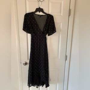 Black flowy dress with adjustable synched waist and gold detailing